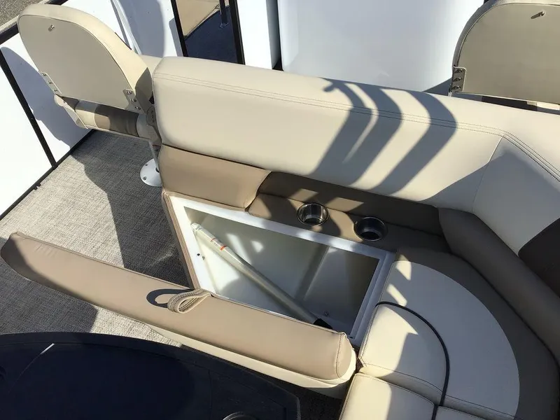 Slide: The Image of 2025 G3 Select 322RF boat interior with beige seating and storage compartment. - 29