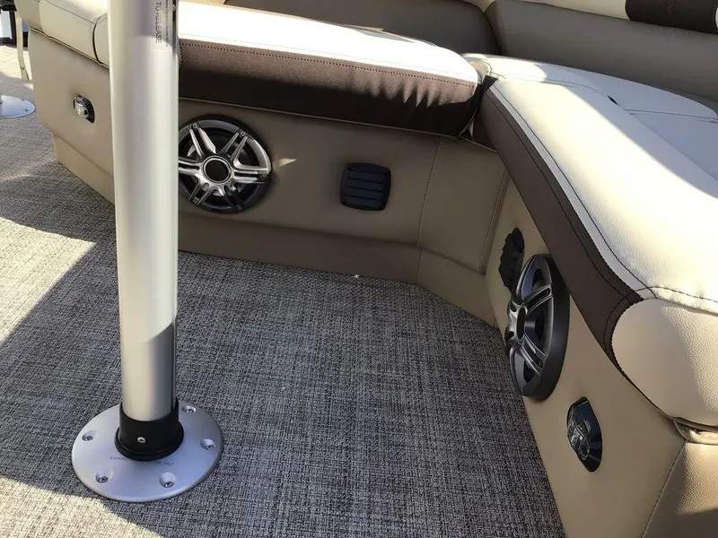 Slide: The Image of 2025 G3 Select 322RF boat interior with beige seating and built-in speakers. - 37