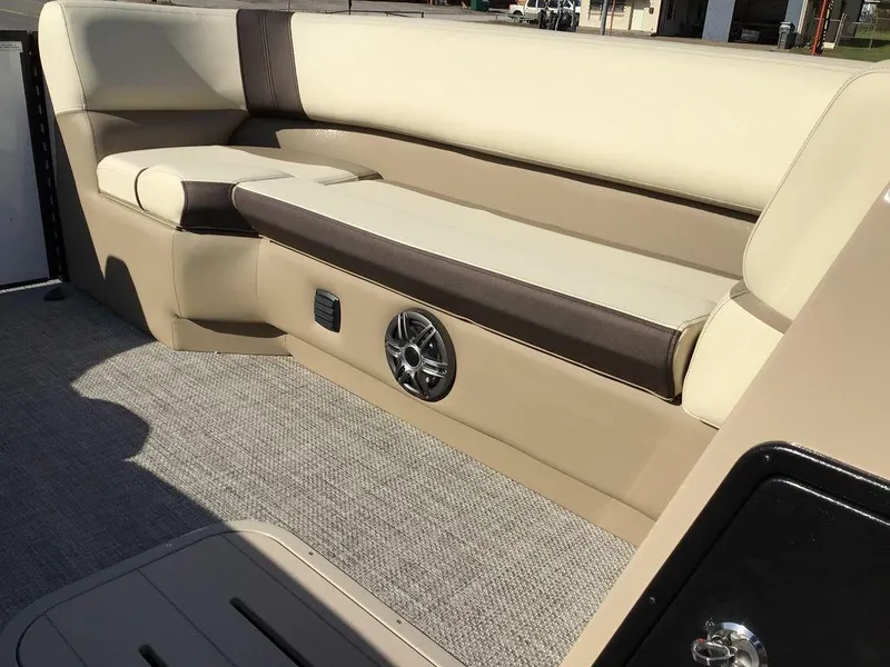 Slide: The Image of 2025 G3 Select 322RF boat interior with beige seating and speaker system. - 38