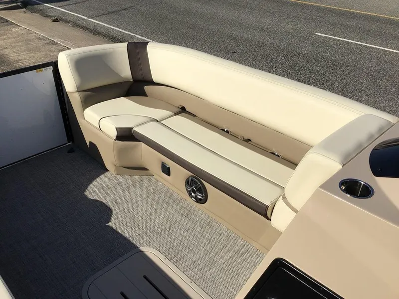Slide: The Image of 2025 G3 Select 322RF boat interior with beige seating and speaker. - 39