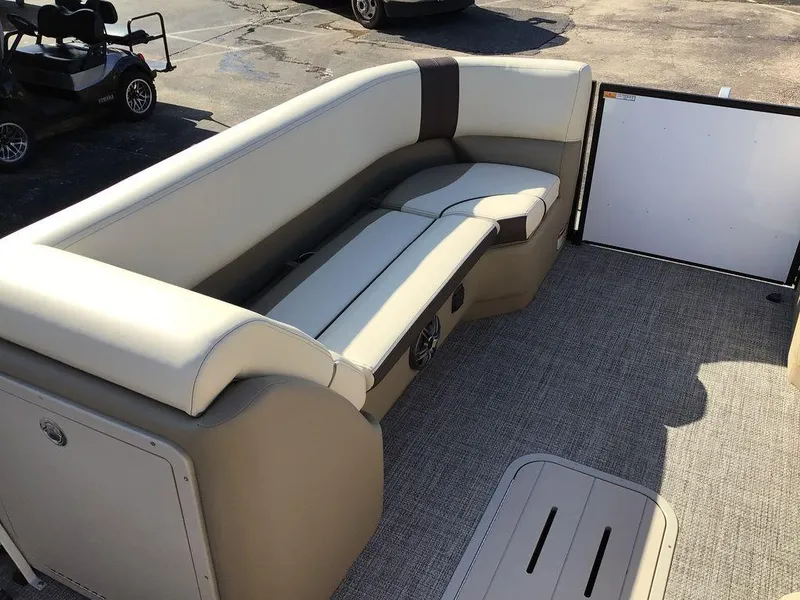 Slide: The Image of 2025 G3 Select 322RF boat interior with beige seating and carpeted floor. - 47