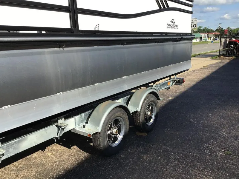 Slide: The Image of 2025 G3 Select 322RF boat trailer with dual wheels on pavement. - 49