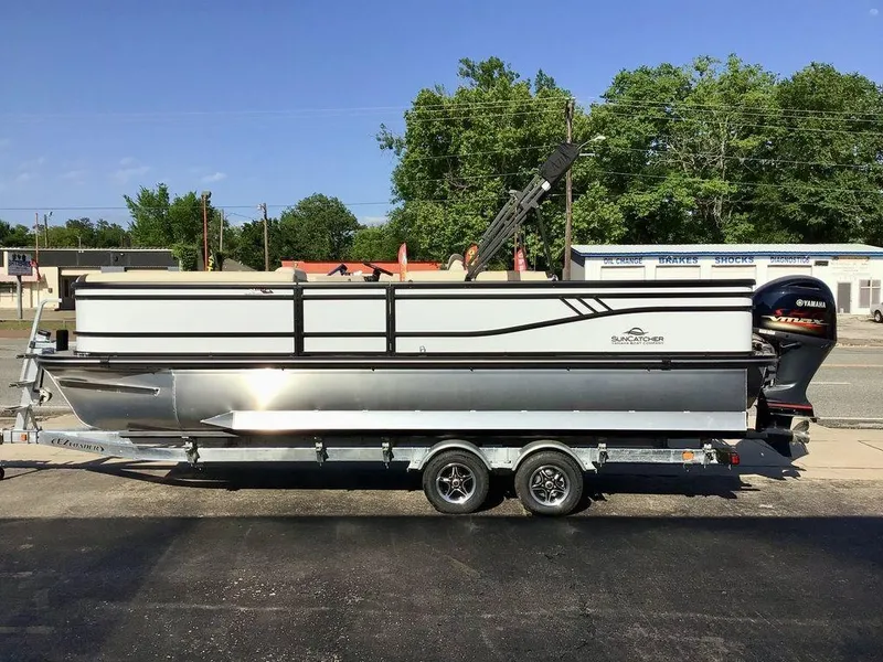 Slide: The Image of 2025 G3 Select 322RF pontoon boat on trailer, parked outdoors. - 5