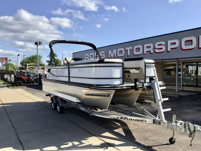 Slide: The Image of 2025 G3 Select 322RF pontoon boat on trailer outside dealership. - 6
