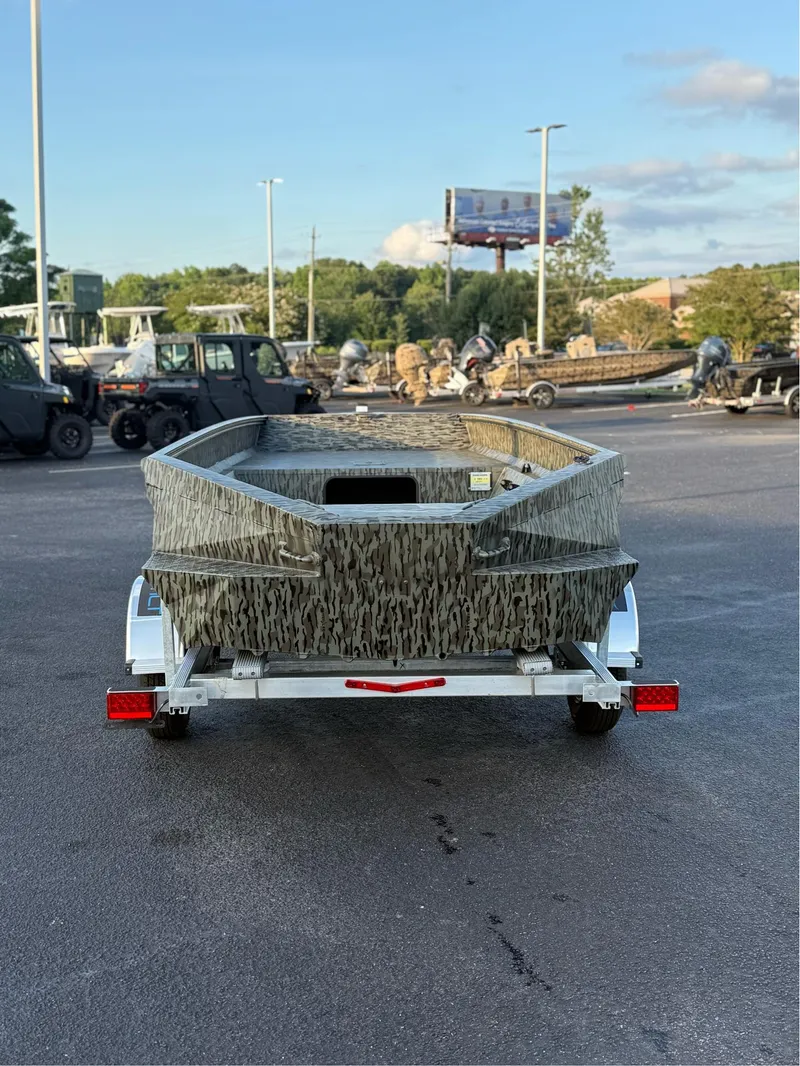 Slide: The Image of 2025 EDGE BOATS 656 DB SPORTSMAN on trailer, parked outdoors. - 3