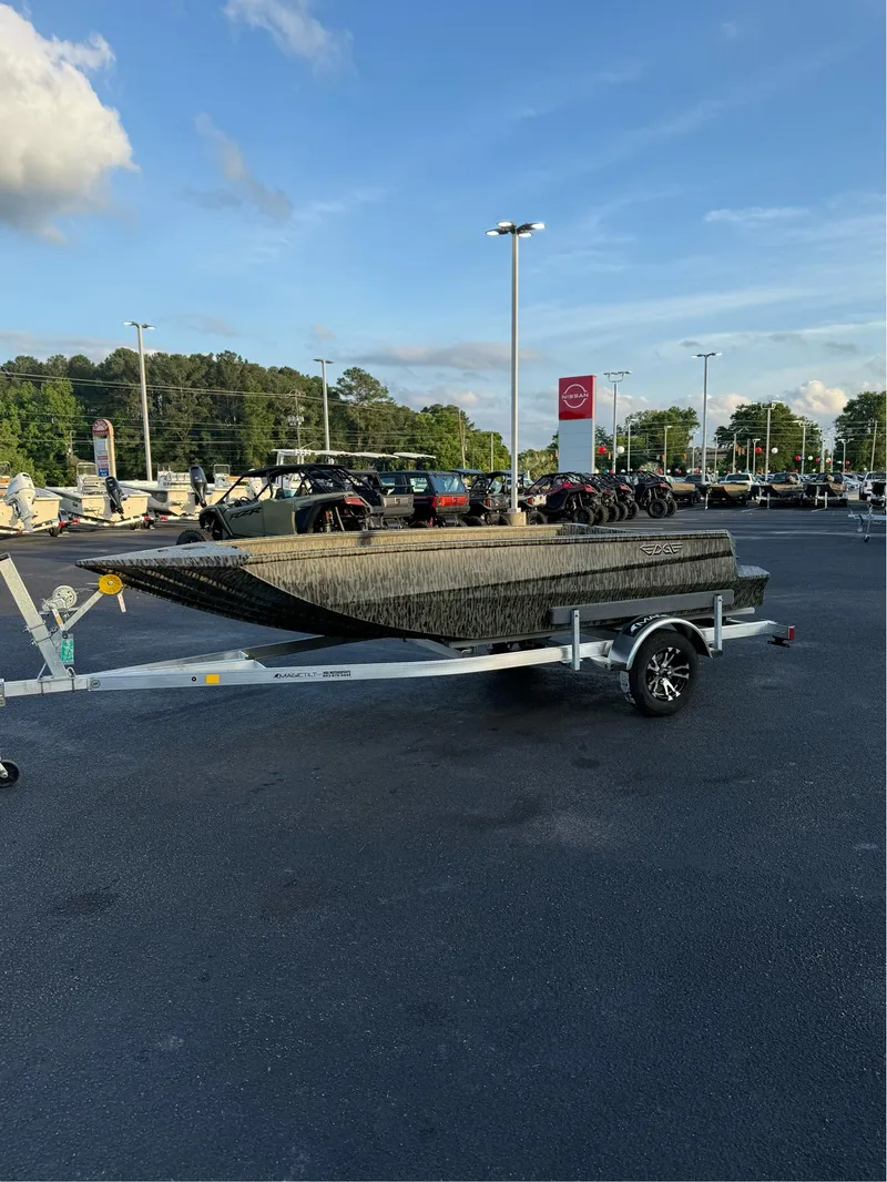 Slide: The Image of 2025 EDGE BOATS 656 DB SPORTSMAN on trailer in parking lot, clear sky background. - 5