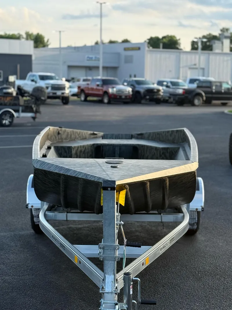Slide: The Image of 2025 EDGE BOATS 656 DB SPORTSMAN on trailer in parking lot. - 6