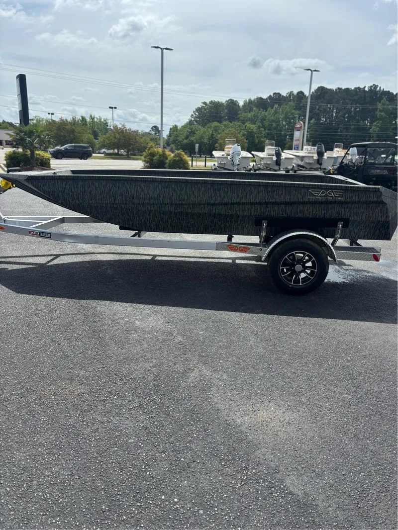 Slide: The Image of 2025 EDGE BOATS 753 on trailer in parking lot, side view. - 13