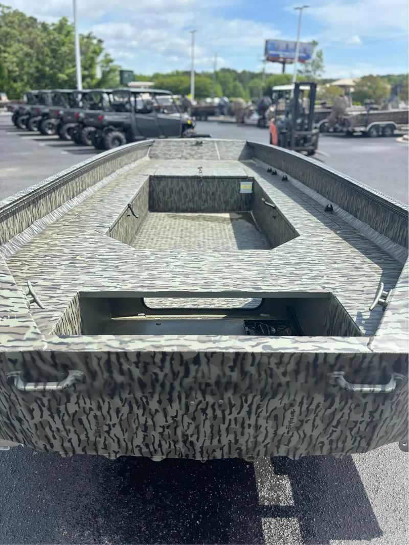 Slide: The Image of 2025 EDGE BOATS 753 model with camouflage design in a parking lot. - 16