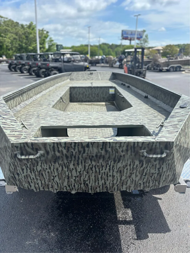 Slide: The Image of 2025 EDGE BOATS 753 with camouflage design in a parking lot. - 17