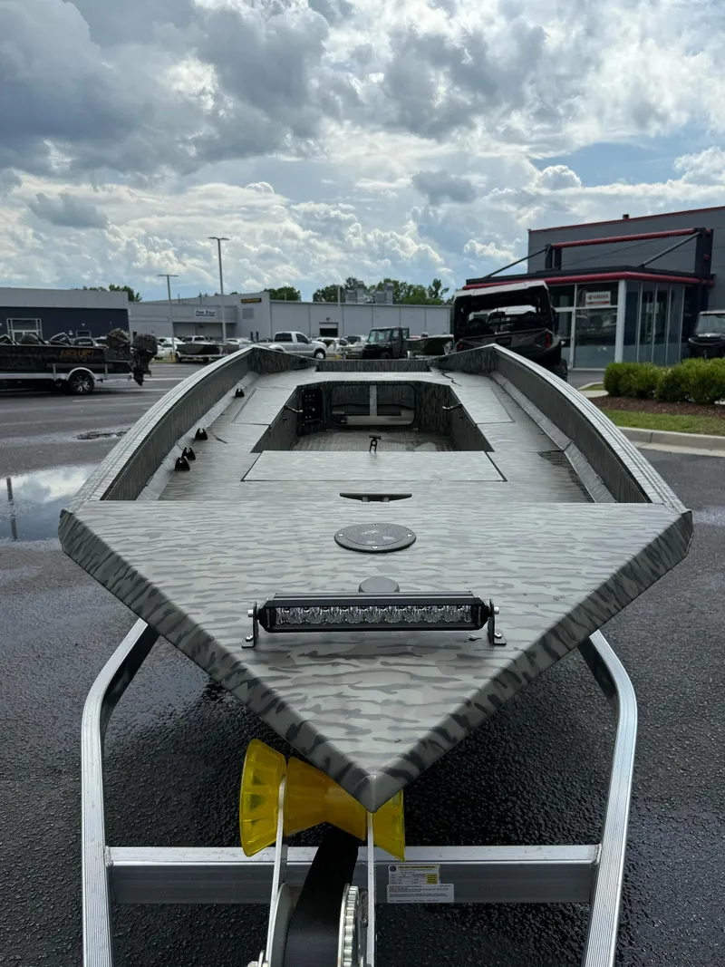 Slide: The Image of 2025 EDGE BOATS 753 model on trailer under cloudy sky. - 4