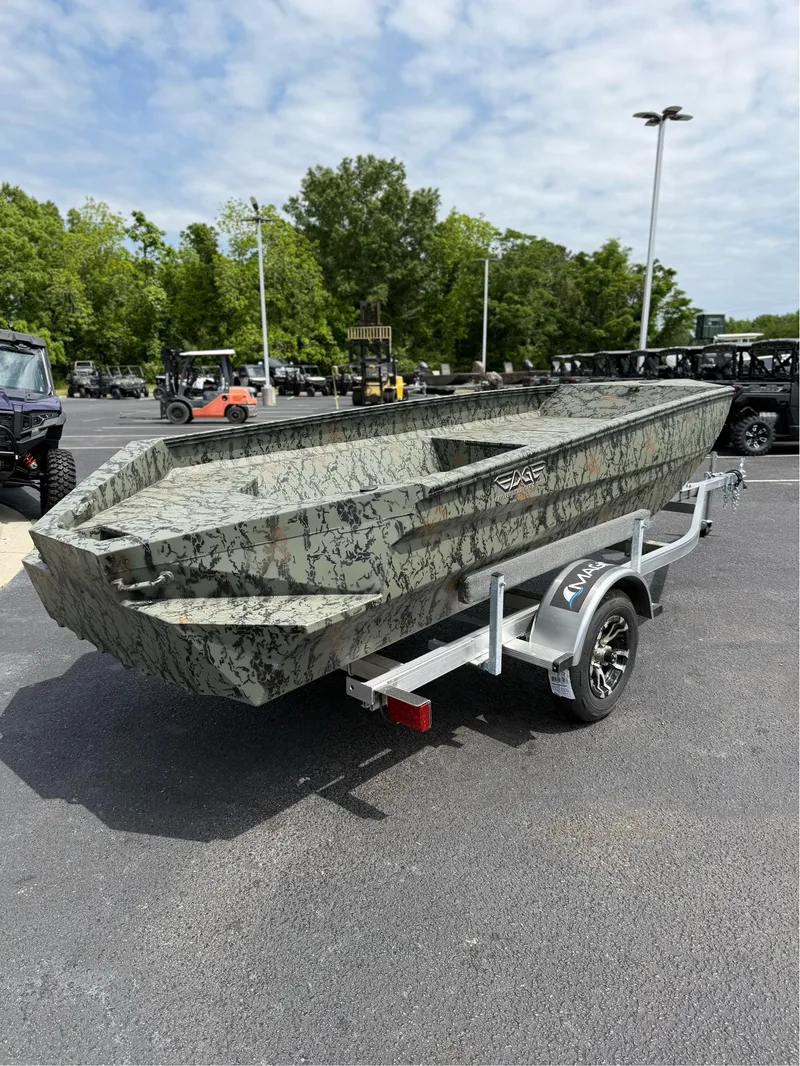 Slide: The Image of 2025 EDGE BOATS 656DB camo boat on trailer in parking lot. - 4