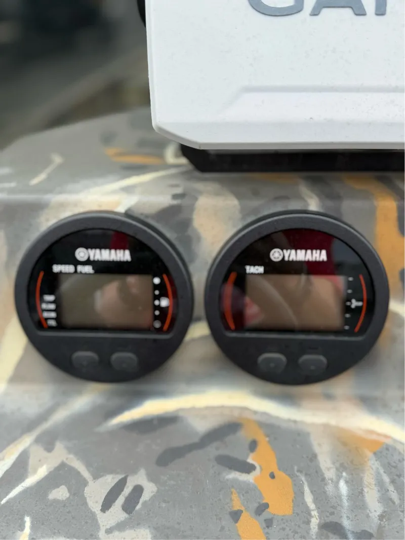Slide: The Image of Yamaha speed fuel and tach gauges on 2022 War Eagle 961 Blackhawk boat. - 22