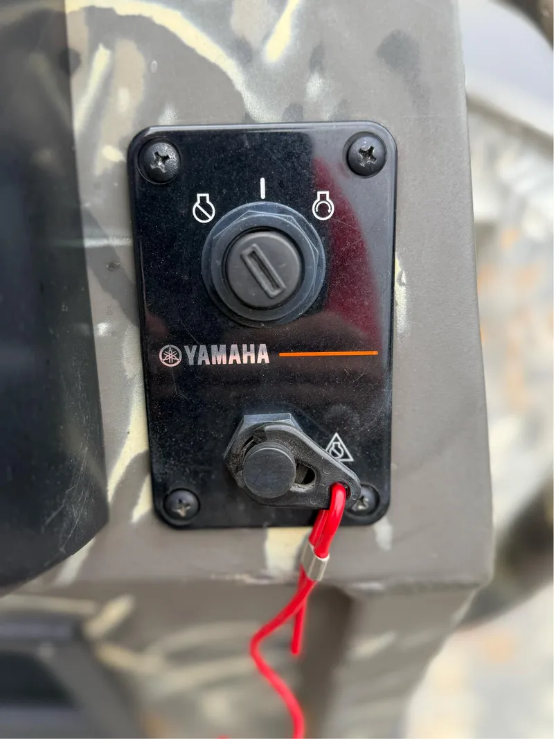 Slide: The Image of Close-up of Yamaha ignition panel on 2022 War Eagle 961 Blackhawk boat. - 26