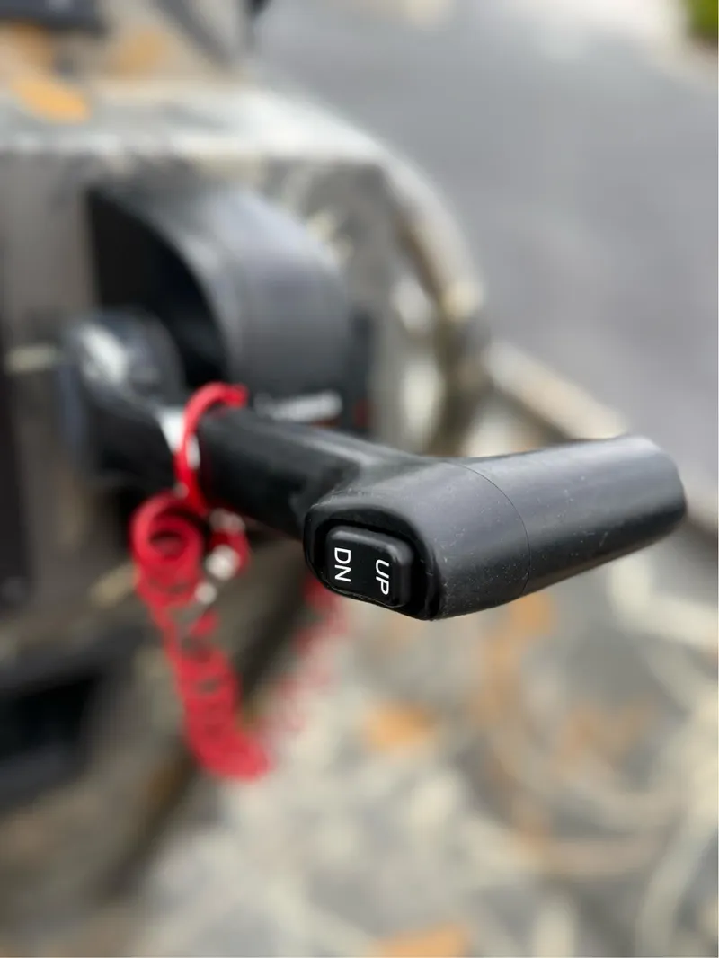 Slide: The Image of Close-up of a 2022 War Eagle 961 Blackhawk throttle handle with red safety cord. - 27