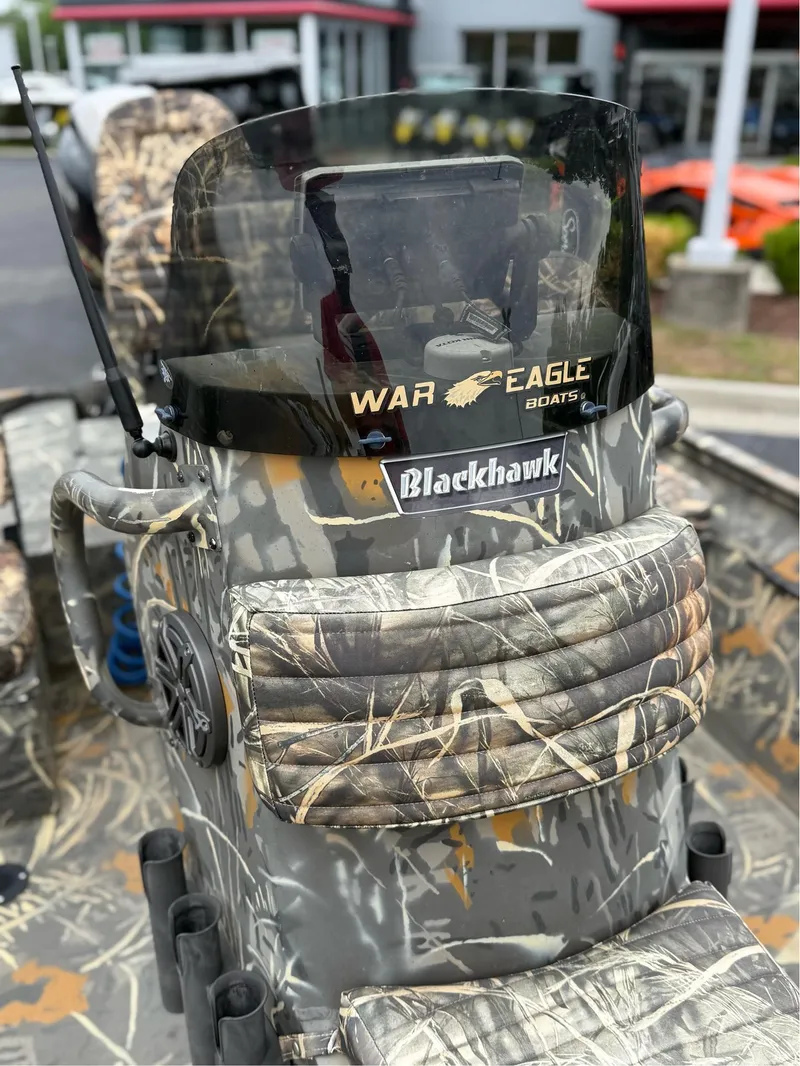Slide: The Image of 2022 War Eagle 961 Blackhawk boat with camouflage design and windshield. - 31