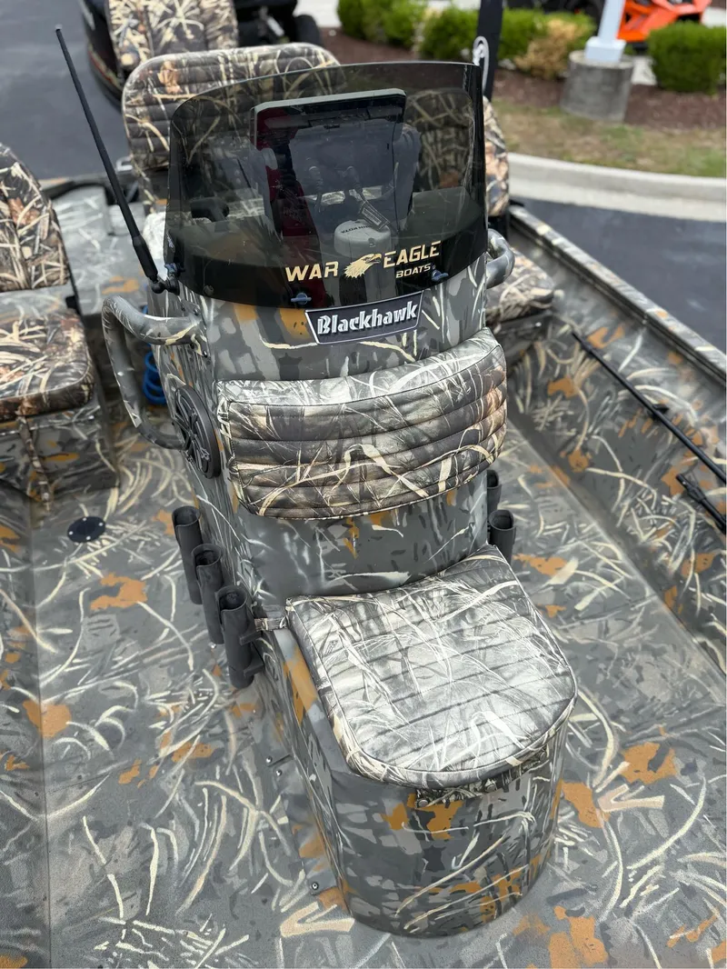 Slide: The Image of 2022 War Eagle 961 Blackhawk boat with camouflage seating and console design. - 32