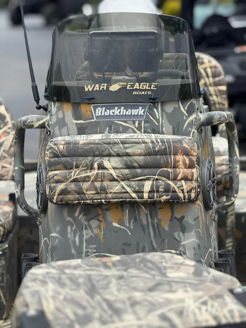 Slide: The Image of 2022 War Eagle 961 Blackhawk boat with camouflage design and windshield. - 4
