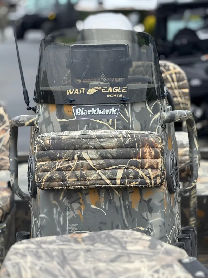 Slide: The Image of 2022 War Eagle 961 Blackhawk boat with camouflage design and windshield. - 5