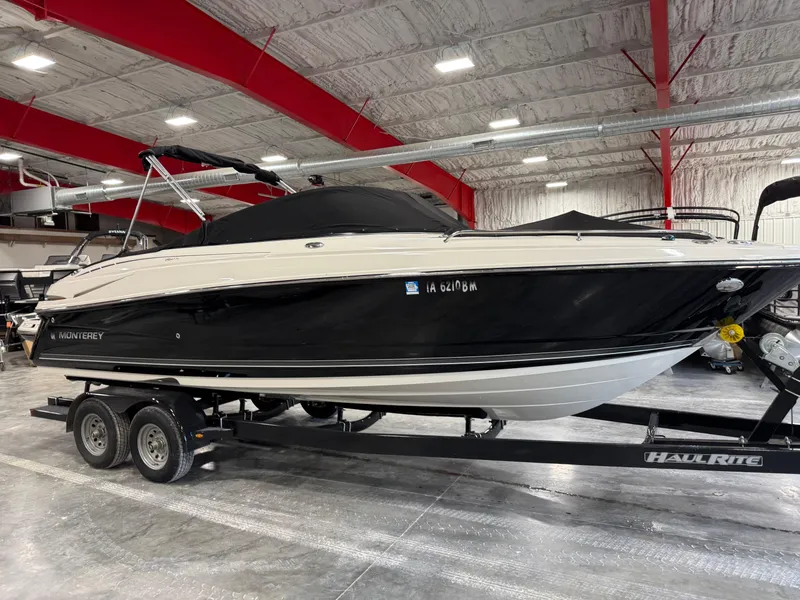 Slide: The Image of 2012 Monterey 264 FS boat on trailer in indoor showroom. - 14