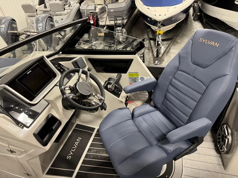 Slide: The Image of 2025 Sylvan G5 boat interior with modern steering and luxurious seating. - 10
