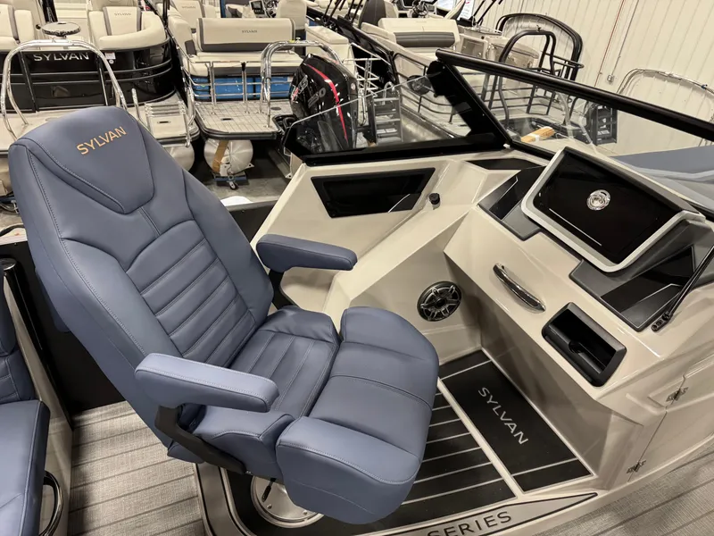 Slide: The Image of Luxurious Sylvan G5 2025 boat interior with plush captain's chair and modern dashboard. - 12