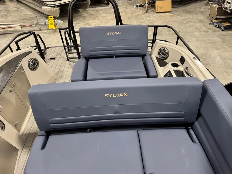Slide: The Image of 2025 Sylvan G5 boat interior with blue seating and speaker system. - 13