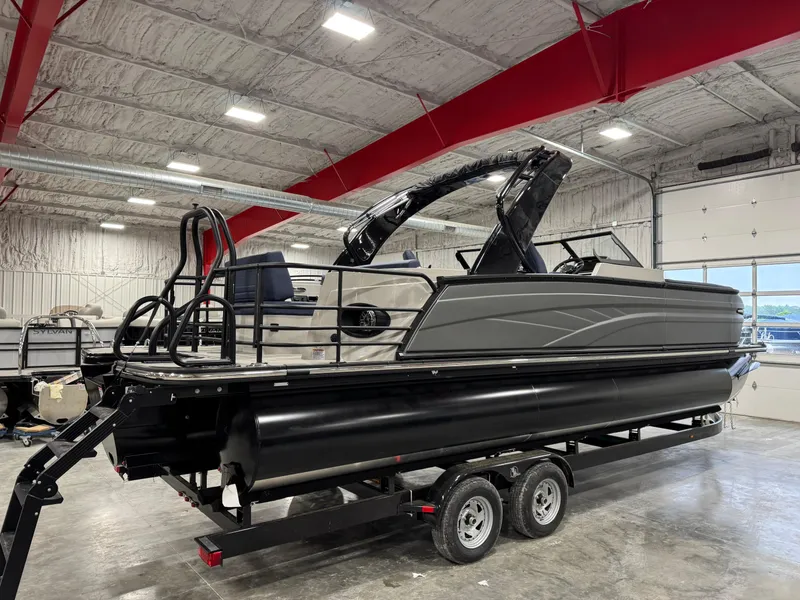 Slide: The Image of 2025 Sylvan G5 pontoon boat on trailer in indoor storage facility. - 4