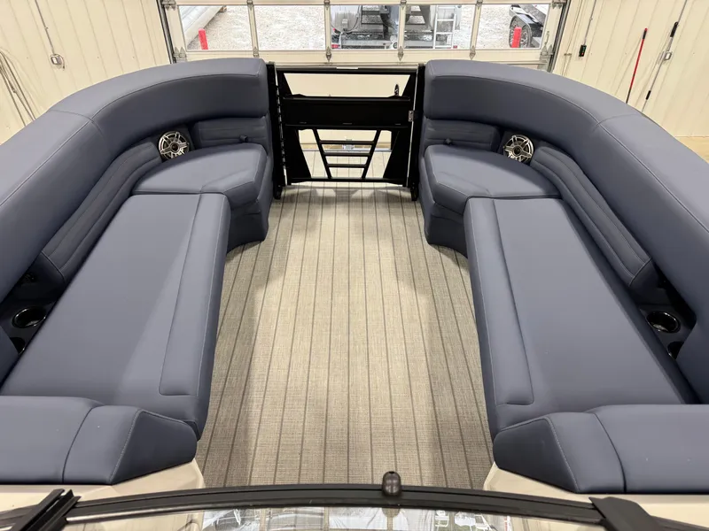 Slide: The Image of 2025 Sylvan G5 boat interior with spacious seating and modern design. - 9