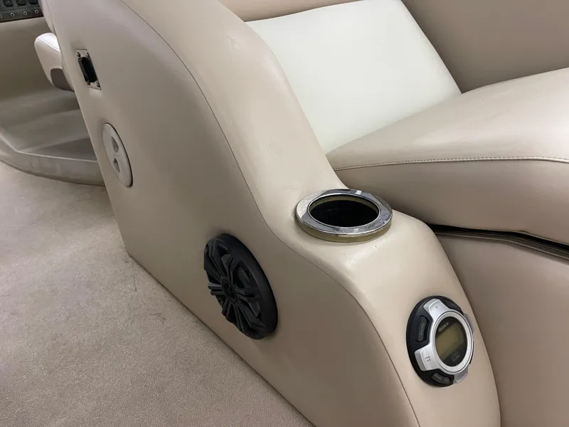Slide: The Image of Interior of 2013 Bennington 22 R boat with cup holder and speaker. - 12