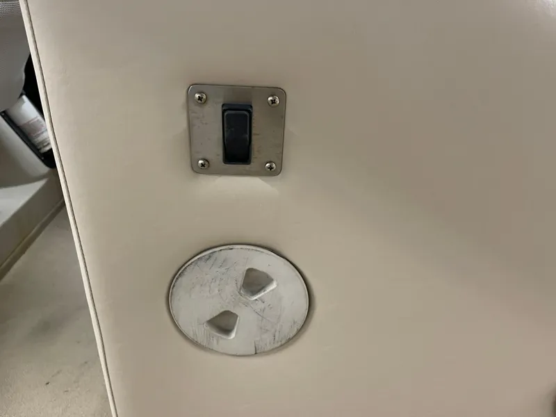 Slide: The Image of Switch and vent on 2013 Bennington 22 R boat interior panel. - 13