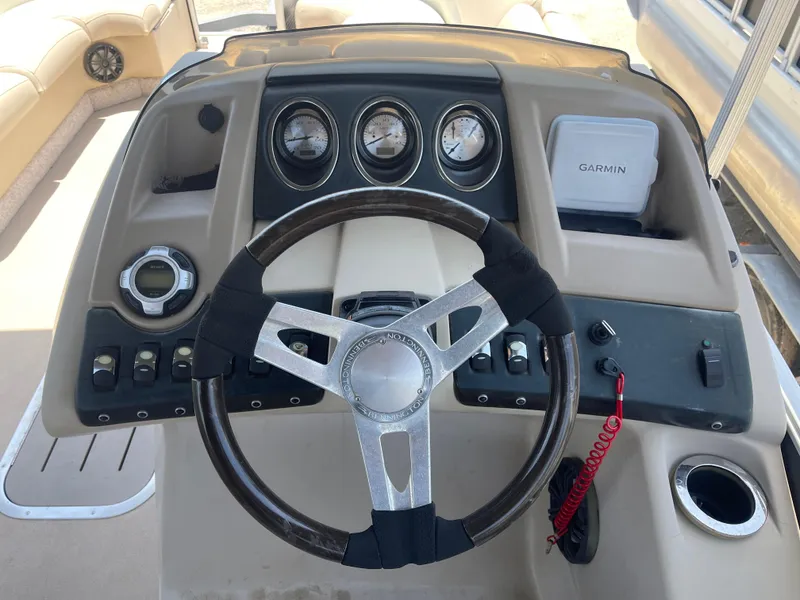 Slide: The Image of Steering console of a 2013 Bennington 22 R boat with gauges and Garmin device. - 18