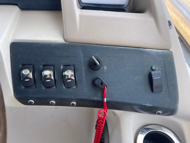 Slide: The Image of Control panel of a 2013 Bennington 22 R boat with switches and ignition. - 20