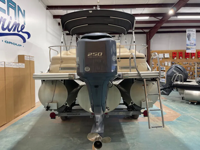 Slide: The Image of 2013 Bennington 22 R pontoon boat with Yamaha 250 engine in showroom. - 7