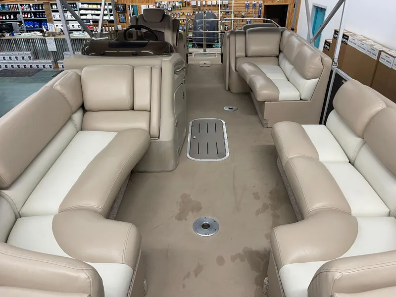 Slide: The Image of Interior of a 2013 Bennington 22 R pontoon boat with beige seating. - 9