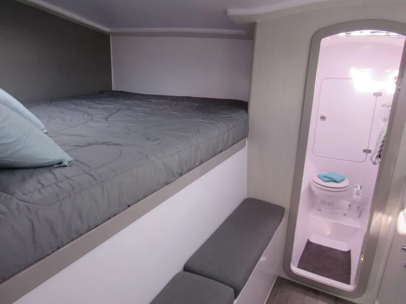 Slide: The Image of 2025 Seawind 1160 Lite interior cabin with bed and bathroom. - 5