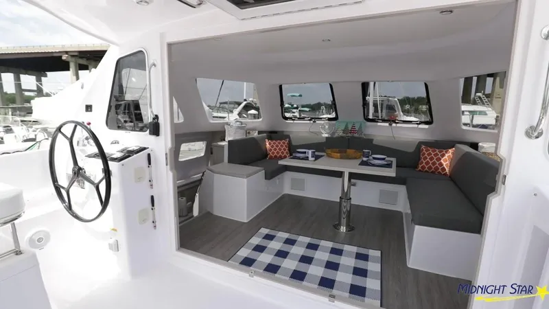 Slide: The Image of 2025 Seawind 1160 Lite yacht interior with modern seating and nautical decor. - 8