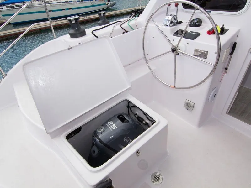 Slide: The Image of 2025 Seawind 1160 Lite yacht helm with open engine compartment. - 9