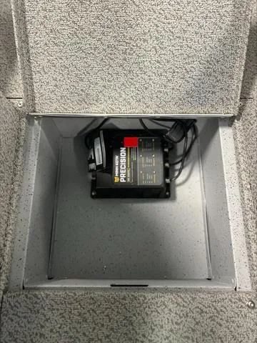 Slide: The Image of 2024 Lund 1875 Alaskan DC boat compartment with Precision battery charger. - 14