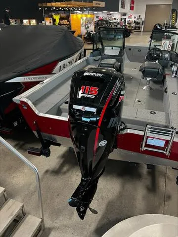 Slide: The Image of 2024 Lund 1875 Alaskan DC boat with Mercury 115 outboard motor displayed indoors. - 20