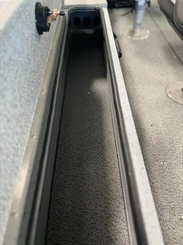 Slide: The Image of Interior view of 2024 Lund 1875 Alaskan DC boat, showcasing storage compartment. - 22