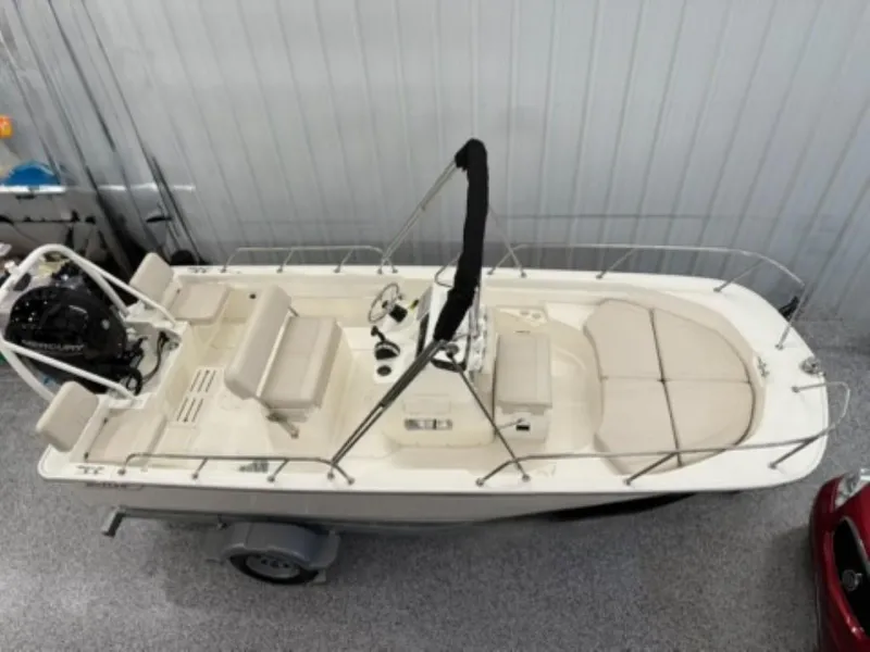 Slide: The Image of 2021 Boston Whaler 170 Montauk boat in indoor storage, top view. - 11