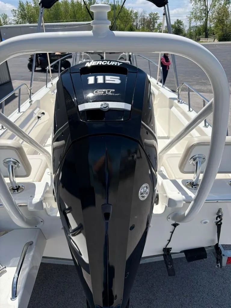 Slide: The Image of 2021 Boston Whaler 170 Montauk with Mercury 115 engine, docked outdoors. - 4