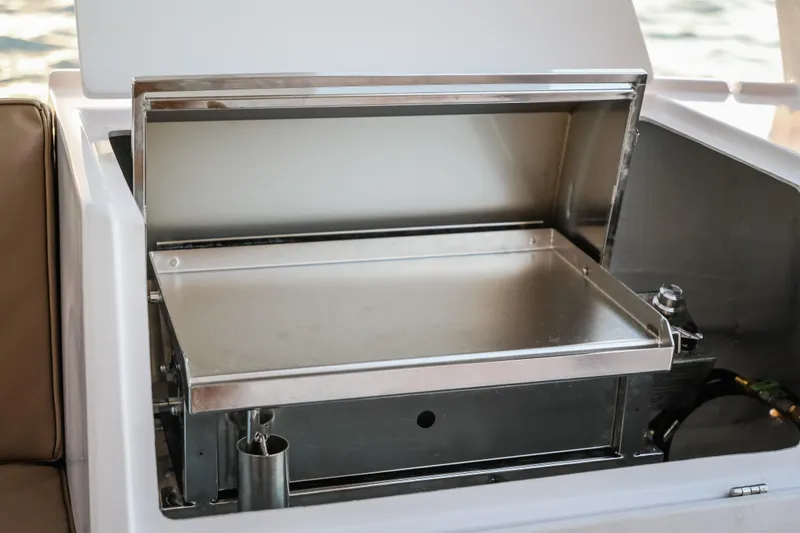 Slide: The Image of Seawind 1260 2025 yacht grill, stainless steel, open lid, outdoor marine kitchen. - 15