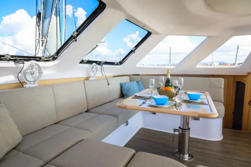 Slide: The Image of Luxurious interior of 2025 Seawind 1260 catamaran with elegant dining setup. - 20