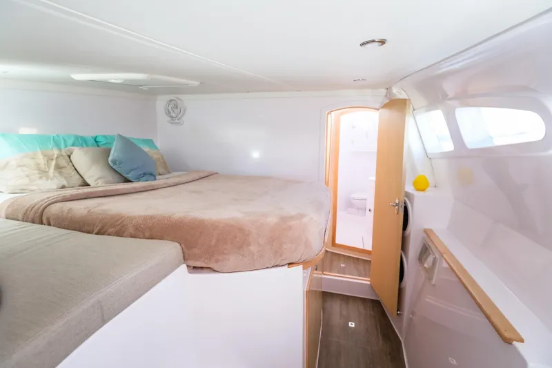 Slide: The Image of 2025 Seawind 1260 interior cabin with cozy bed and modern design. - 26