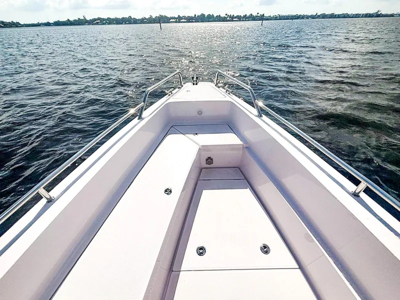 Slide: The Image of 2022 Axopar 28 CABIN boat bow view on open water. - 10