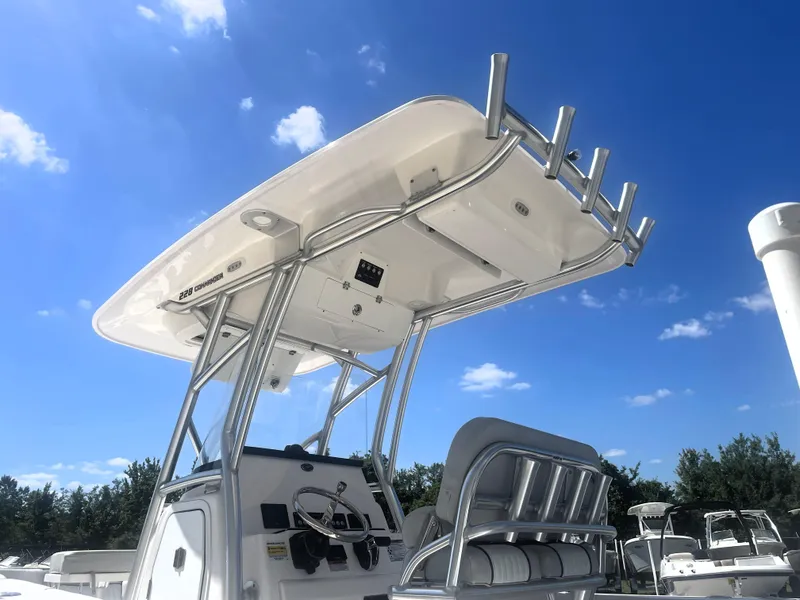 Slide: The Image of 2023 Sea Fox 228 Commander boat with T-top under clear blue sky. - 14