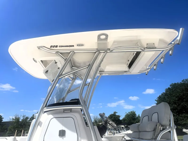Slide: The Image of 2023 Sea Fox 228 Commander boat with T-top against clear blue sky. - 15