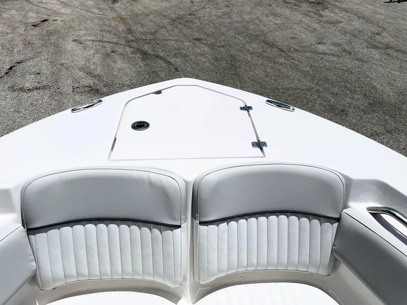 Slide: The Image of 2023 Sea Fox 228 Commander boat bow with cushioned seating and storage hatch. - 18